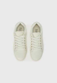 White sneakers with a smooth leather-like upper, round toe, six laces, and gold-tone eyelets. Minimalistic design with padded collar for comfort.