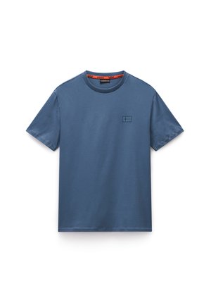 Blue cotton T-shirt with a crew neck, featuring a small embroidered square flag logo on the left chest and contrasting inner neck tape.