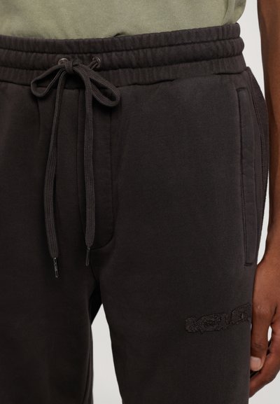 Ksubi INVERSED SYNTHESIS PANT FADED - Treniņtērpa apakšda�ļas - black