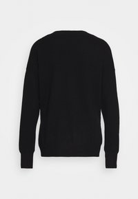Black sweater with a loose, relaxed fit, long sleeves, and a ribbed hem. Made of a soft knit material with a smooth texture.