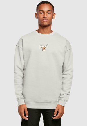 Light grey sweatshirt with long sleeves, featuring a reindeer graphic on the chest. Soft fabric texture and ribbed cuffs.