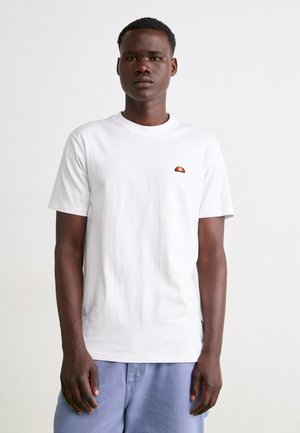White cotton T-shirt, crew neckline, short sleeves, featuring a small multicolor embroidered logo on the left chest. Plain and smooth texture.