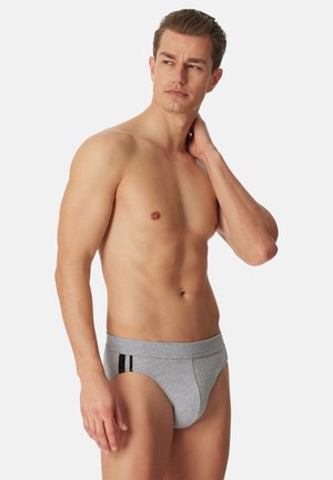 Slip grigio in cotone con design aderente, caratterizzato da un dettaglio a striscia nera sui lati. Tessuto morbido e fascia elastica in vita per il massimo comfort.