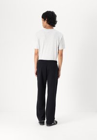 Hollister Co. LOGO JOGGER - Treniņtērpa apakšdaļas - black beauty