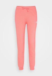 Rosa fleece joggers med elastisk midja och dragsko, uppvikta anklar och en liten vit Nike-logga på vänster lår.