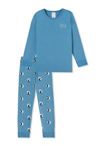 Haut de pyjama à manches longues bleu avec un petit motif d'ours, associé à un legging bleu avec un motif de croissant de lune en noir et blanc. Tissu doux.
