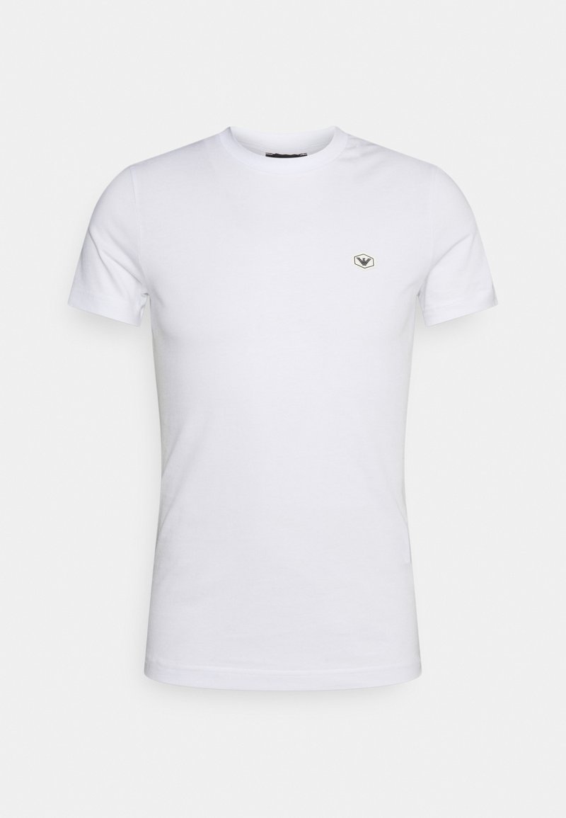 White cotton t-shirt with a crew neckline, short sleeves, and a small embroidered logo in the upper left chest area.