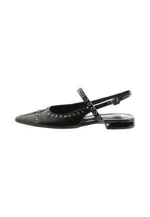 Black leather slingback shoe with pointed toe, studded accents, and an adjustable strap featuring circular cutouts. Low heel design.