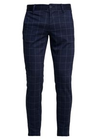 Navy plaid trousers with a fitted design, featuring a flat front, button closure, and subtle check pattern in cream against the dark material.