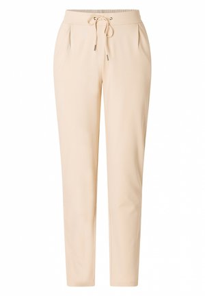Beige jogger pants made from a soft fabric. Features a drawstring waistband, pleats at the front, and tapered legs. Smooth texture.