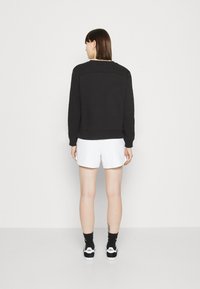 Calvin Klein Jeans MONOLOGO REGULAR CREWNECK - Sweatshirt - black