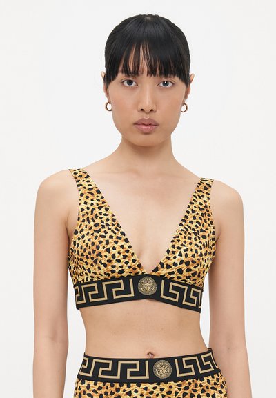 Bralet s leopardím potiskem a hlubokým V-výstřihem, širokými ramínky a černým pásem se zlatým medailonem a vzorem řeckého klíče. Měkká, elastická látka.