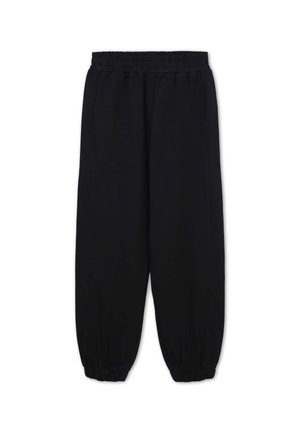 Pantalons de survêtement noirs en tissu doux avec une taille élastique, des poches latérales et des poignets élastiques aux chevilles.