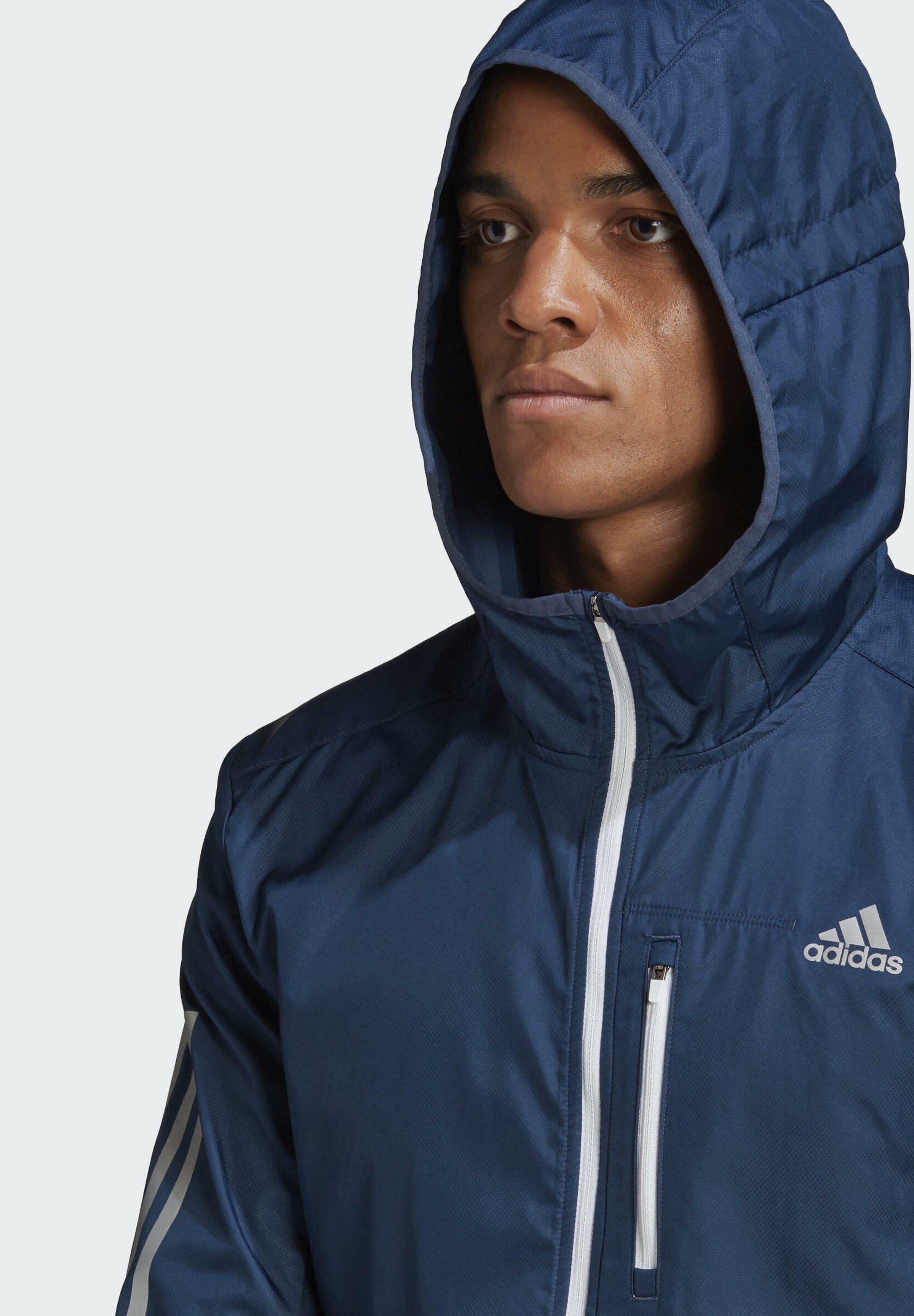 own the run hooded windbreaker