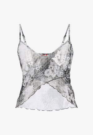 Czarna i biała półprzezroczysta koszulka na cienkich, regulowanych ramiączkach, z kwiatowym i zwierzęcym nadrukiem oraz asymetrycznym dołem.