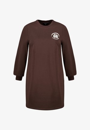 Bruine katoenen jurk met lange mouwen, ronde halslijn en geribbelde manchetten. Voorzien van een witte grafische print op de bovenste linkerborst.