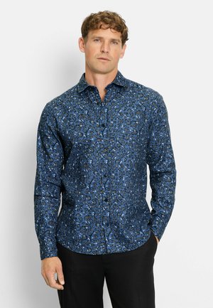Blaues Blumen-Hemd mit Knopfverschluss, mit einem gemusterten Design, langen Ärmeln und schmalem Schnitt. Kombiniert mit einer schwarzen Hose. Weiche Stoffqualität.