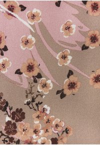 Floral fabric featuring light pink background with beige and brown flowers, textured weave with detailing in petals and stems.