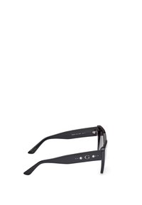 Black sunglasses with a square frame, featuring glossy plastic material, metal accents, and a logo on the temple. Lenses appear dark.