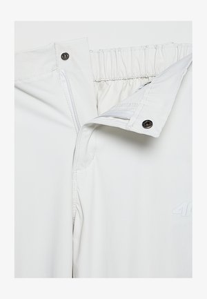 Białe spodnie na elastycznej talii z zamkiem błyskawicznym i zapięciem na zatrzask. Gładka tekstura, z subtelnym logotypem z przodu.