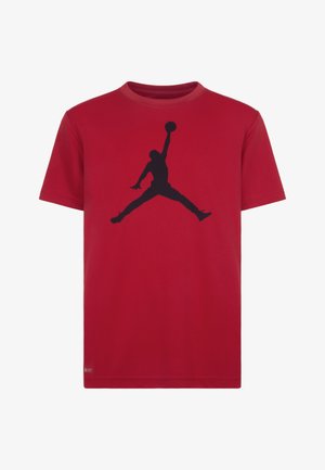 Camiseta de algodón roja con mangas cortas, que presenta un gran logo negro de Jumpman centrado en la parte delantera. Diseño estándar de cuello redondo.