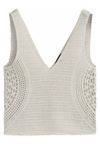 Bia�ły szydełkowany crop top z głębokim dekoltem w kształcie V oraz skomplikowanymi wzorami ażurowymi po bokach.