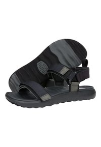 Sandalo nero con cinturini in tessuto regolabili, suola interna testurizzata e suola in gomma flessibile con motivo a onde.