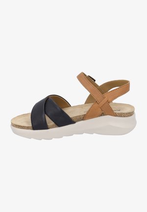 Women's sandals with black and tan leather straps, adjustable ankle buckle, contoured footbed, and a lightweight white rubber sole.