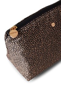 Black and beige patterned pouch made of fabric with a smooth texture. Features a zip closure and a gold-tone hardware accent.
