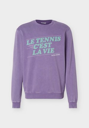 Purple crewneck sweatshirt with turquoise text "LE TENNIS C'EST LA VIE" and small "BJÖRN BORG" branding on front.