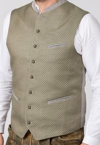 Helles grünes Westchen mit einem Rautenmuster, ausgestattet mit einem grauen Kragen, Knöpfen vorne und zwei Seitentaschen. Strukturierter Stoff.