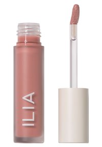 Prodotto labbra ILIA in confezione di vetro satinato, tonalità rosa tenue, include un applicatore trasparente con punta a forma di piede di daino testurizzata.
