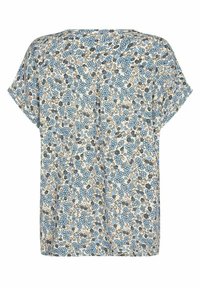 Top de manga corta en un tejido beige, con un patrón floral en azul y gris. Corte amplio con un ajuste relajado y sin herrajes visibles.
