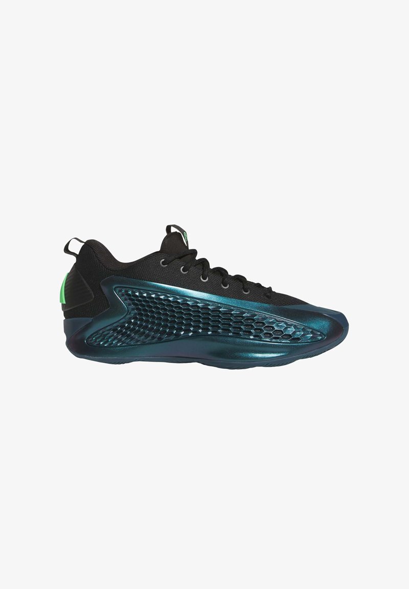 Scarpe sportive nere con tomaia texturizzata, design a nido d'ape sul lato e suola lucida color teal con accenti verdi.