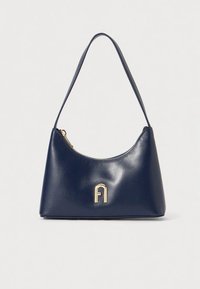 Navy leather handbag with a curved shape, a smooth texture, and a gold accent logo on the front. Features a single shoulder strap and zipper closure.