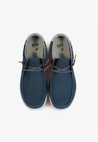 Blue canvas shoes with a textured upper, contrast stitching, and rubber sole. Features decorative accents and a lace fastening system.