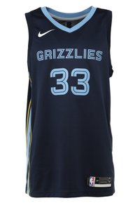 Maillot de la NBA en bleu marine avec des lettres bleu clair. "GRIZZLIES" et le numéro "33" affichés en évidence. Logo Nike en haut, tissu texturé.