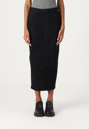 Black denim midi skirt with a front button line, two pockets, and a fitted waist, paired with black slip-on shoes.
