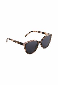 Lunettes de soleil en écaille de tortue avec des verres surdimensionnés, une large monture et des branches fines au toucher lisse. Les verres foncés offrent une protection solaire.