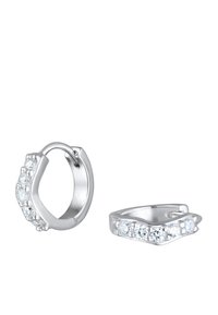 Boucles d'oreilles créoles en argent avec un design ondulé, ornées de pierres claires et étincelantes d'un côté. Fini métallique lisse, structure légère.