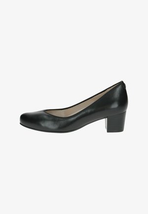 Scarpa pump nera in pelle con tacco basso, punta arrotondata e texture liscia; presenta una leggera curva sul collo del piede e una soletta imbottita.