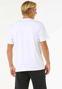 White cotton t-shirt with short sleeves, a round neckline, and a relaxed fit. Back view shows smooth texture and no visible patterns.