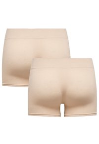 Beige naadloze boyshorts met een zachte textuur, een mid-rise tailleband en geen zichtbare naden, ontworpen voor comfort en een soepele pasvorm.