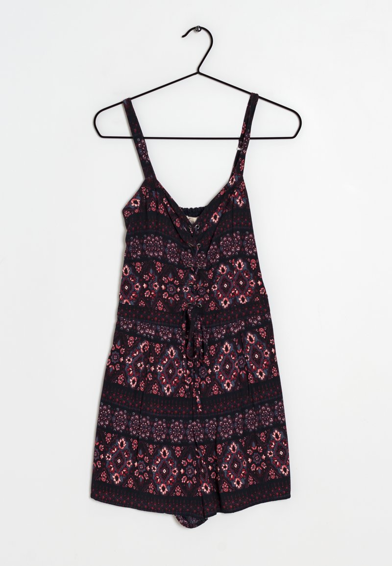 Black sleeveless romper with colorful floral and geometric patterns, featuring a drawstring waist and a V-neckline. Lightweight fabric.