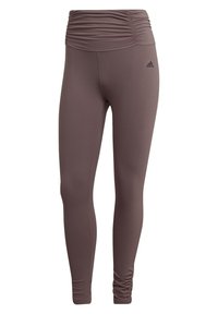 Brune atletiske leggings med en rynket talje, lavet af glat, strækbart stof. Har et Adidas-logo på venstre ben.