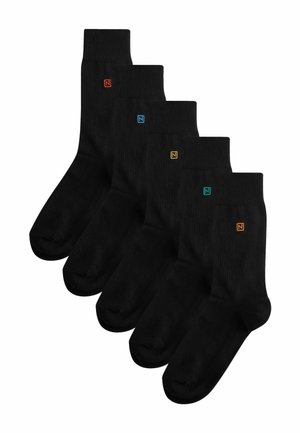 Black cotton socks set of four. Features colored logo accents in orange, blue, yellow, and green on the ribbed cuff. Smooth texture.