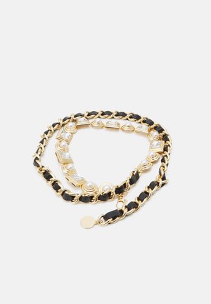 Gold chain belt with black leather woven through links and decorative pearls and square crystals, displayed coiled on white background.