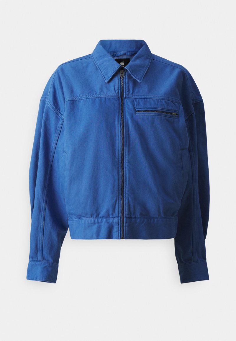 Blaue Jeansjacke mit durchgehendem Reißverschluss, Hemdkragen und langen Ärmeln. Mit einer Brusttasche und Nahtdetails. Glatte Textur.