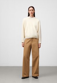 Jeans a zampa - camel