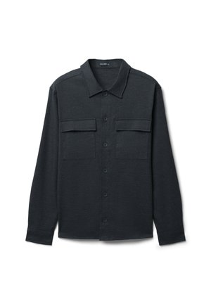 Dunkelgraues Hemd mit knopffreiem Kragen, zwei Brusttaschen und langen Ärmeln mit geknöpften Manschetten. Strukturierter Stoff.